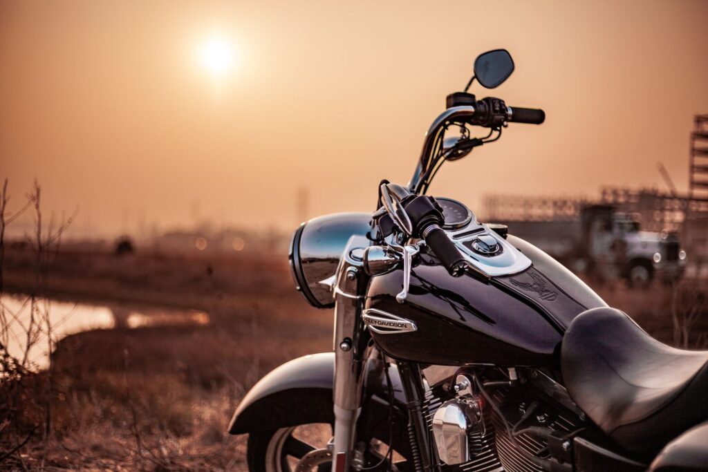 Calm motorcycle parked near a suburban curb in soft daylight, representing California motorcycle and delivery truck crash claim education.