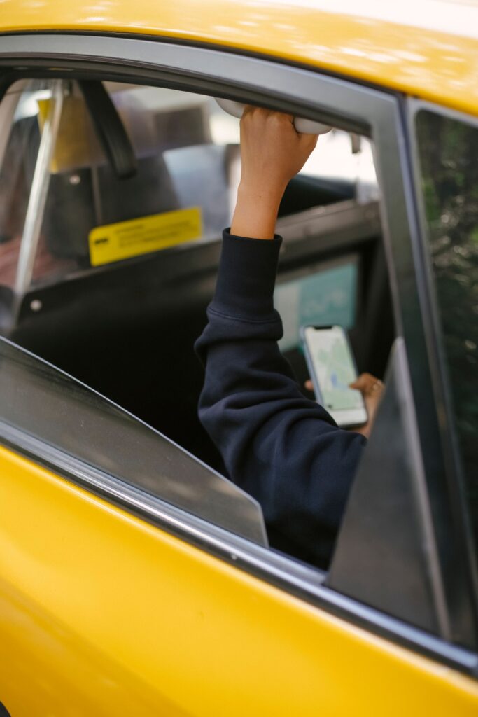Calm smartphone and urban curb in soft daylight, representing Orange County rideshare passenger safety and abandonment-claim education.