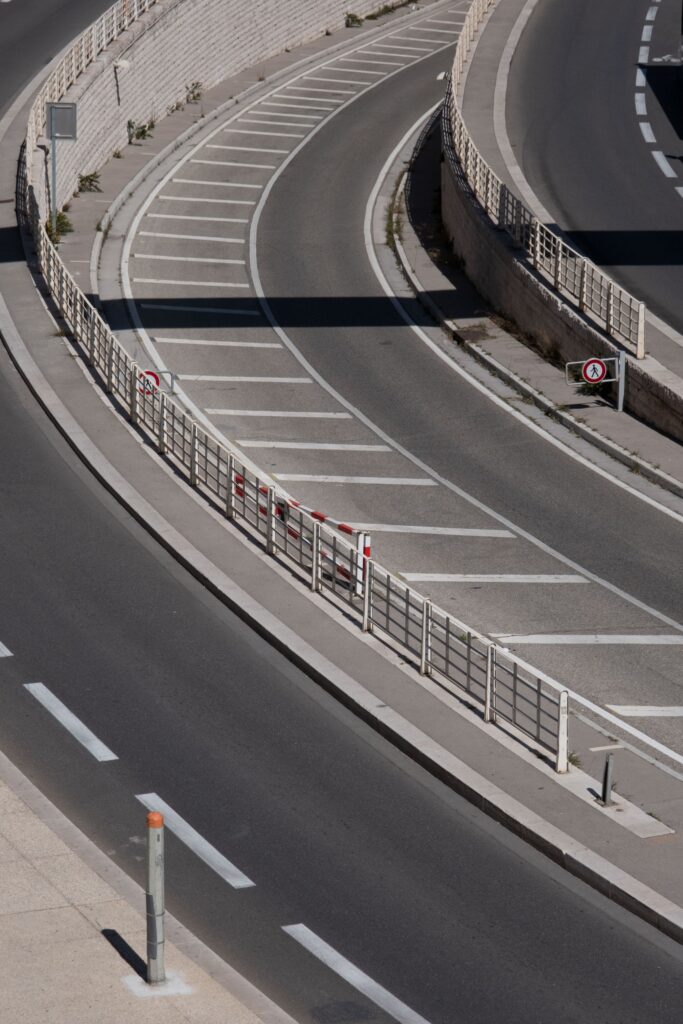 Soft-focus Southern California freeway curve in calm daylight, representing San Ysidro border-corridor delivery truck crash claim education.